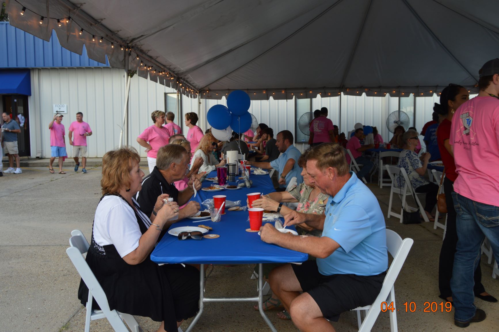 People Enjoyng the Fried Fish at the Threaded Fasteners Charitable Foundation Weekend 2019 Open House