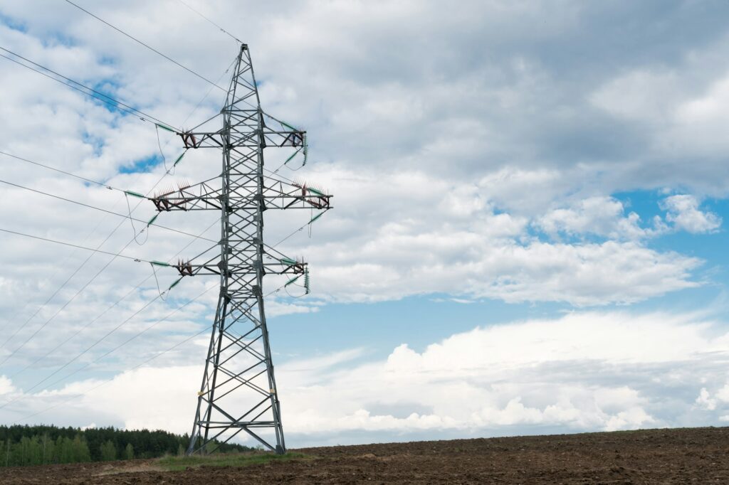 high-voltage power line pole in the countryside